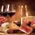 Prodotto tipico, tagliere con calici di vino, salumi e formaggi